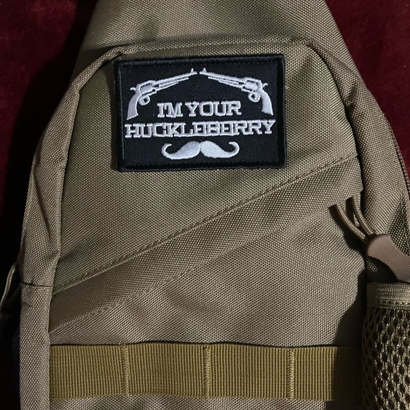 This is an over the shoulder bag… With a great patch on it. Used it once - Picture 2 of 5